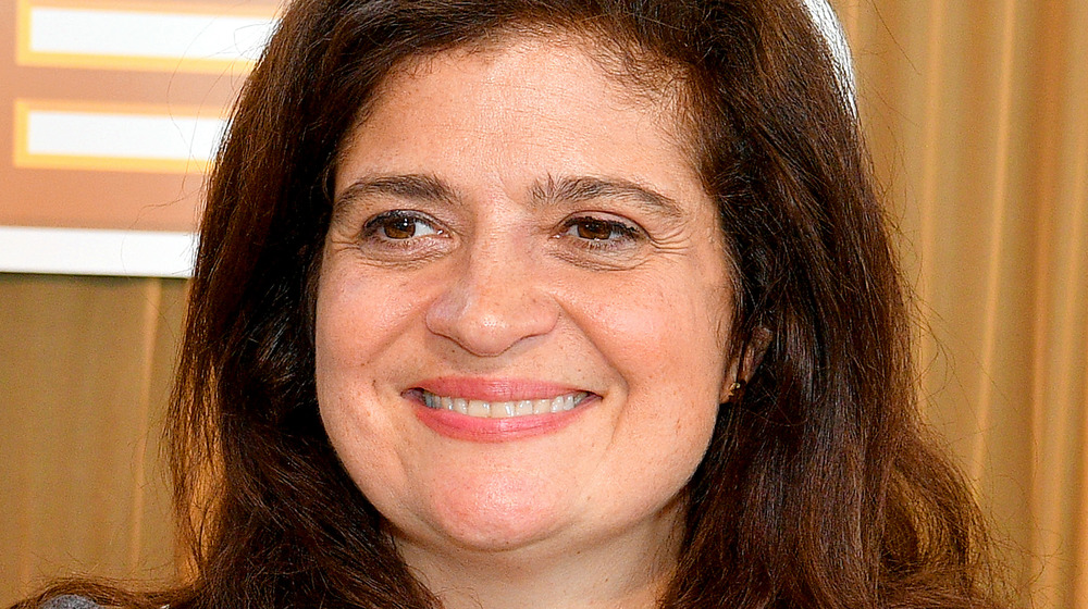 Alex Guarnaschelli smiling and looking off