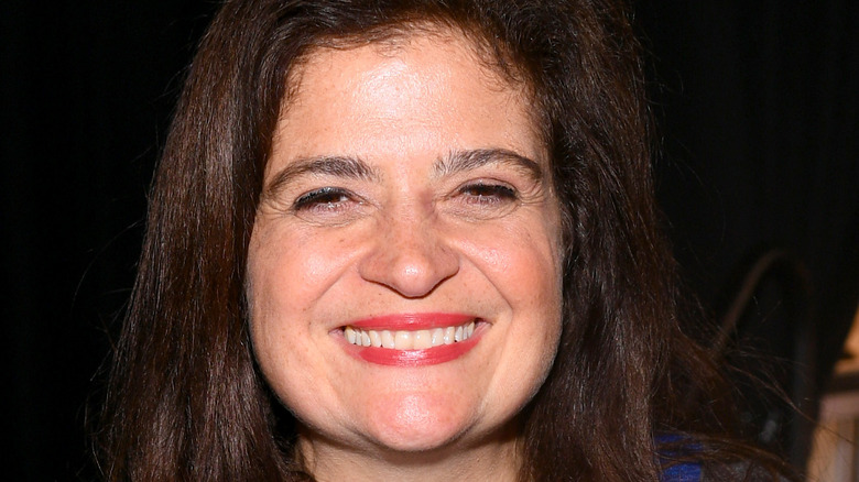 Alex Guarnaschelli wearing a grey sweater smiling