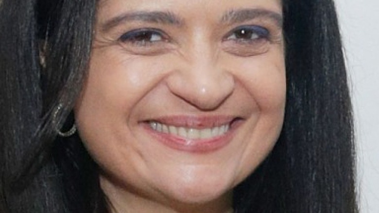 alex guarnaschelli smiles in close-up