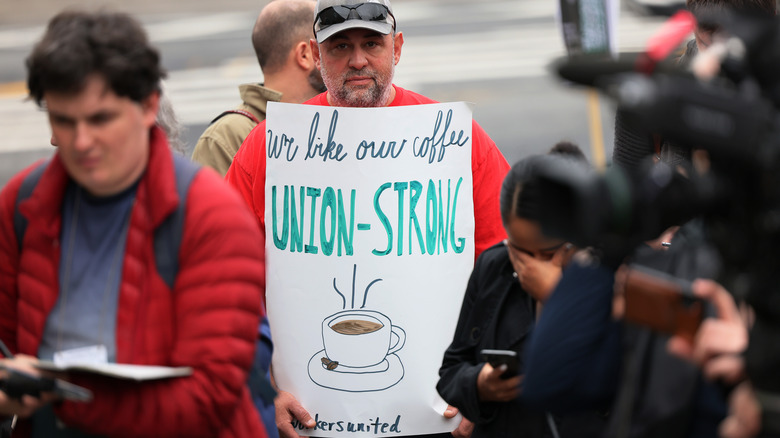 Starbucks Workers United protestor holding pro-union sign