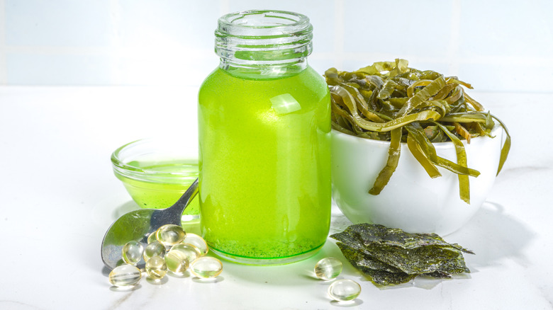 A jar of algae oil and a bowl of seaweed