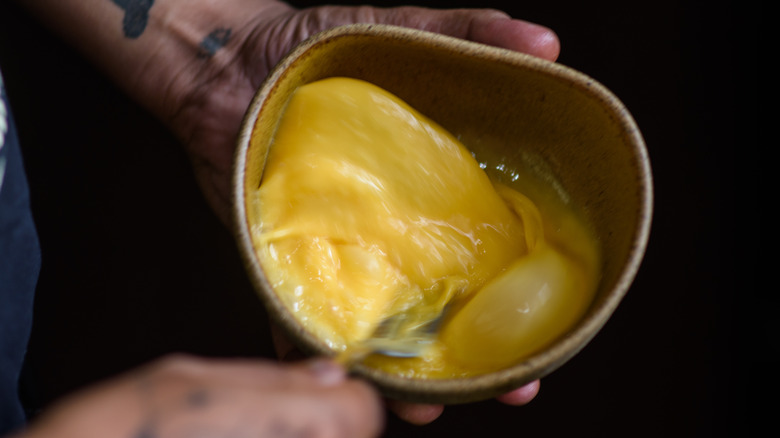 Whisked egg in a bowl