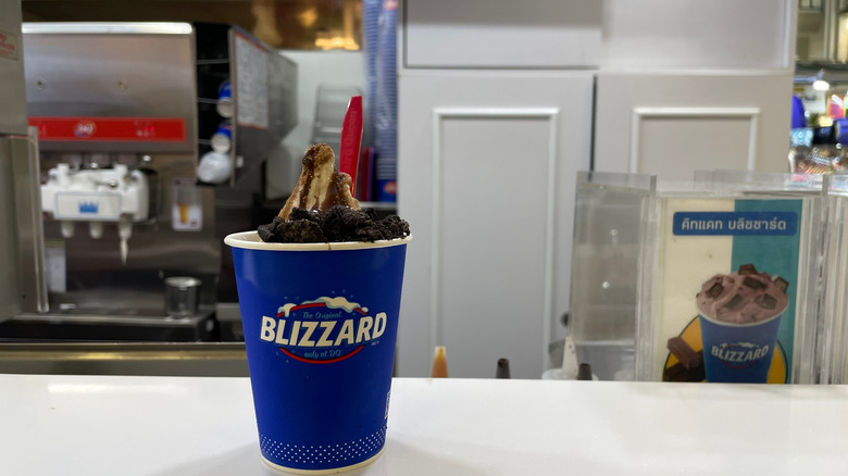 Blizzard sitting on a counter inside a Dairy Queen