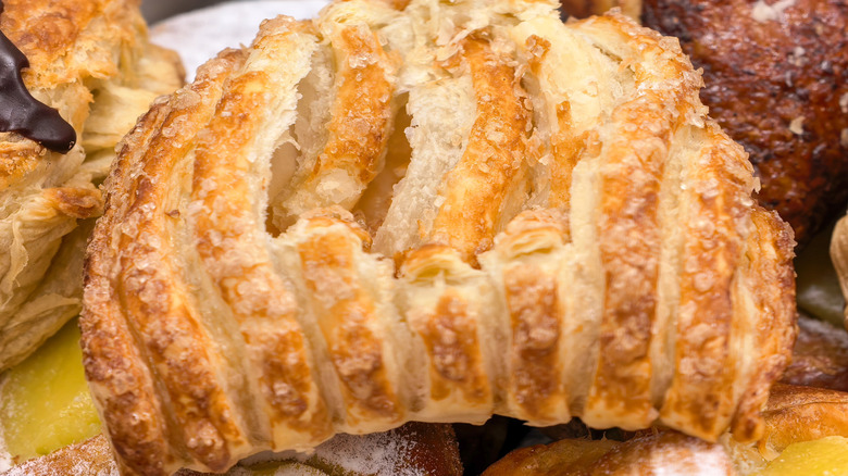 Closeup of crystallized pastry with other baked goods in the backbround