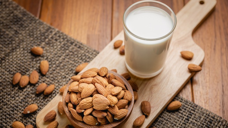 Almond milk with scattered almonds