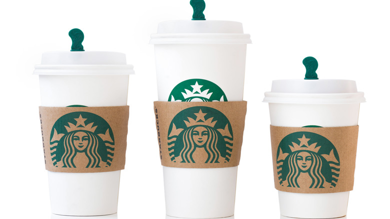 Three cups with Starbucks logo