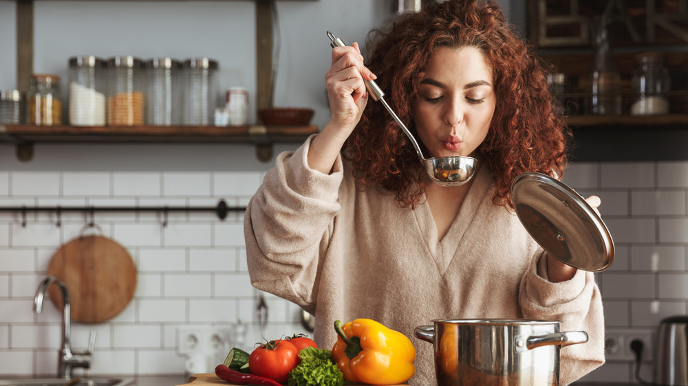 Woman eating soup