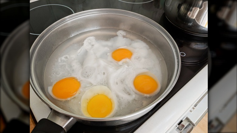 Eggs being poached