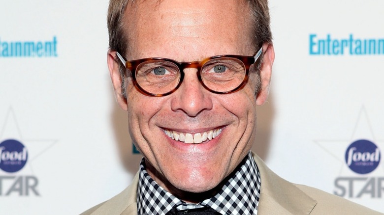 Alton Brown wearing brown glasses