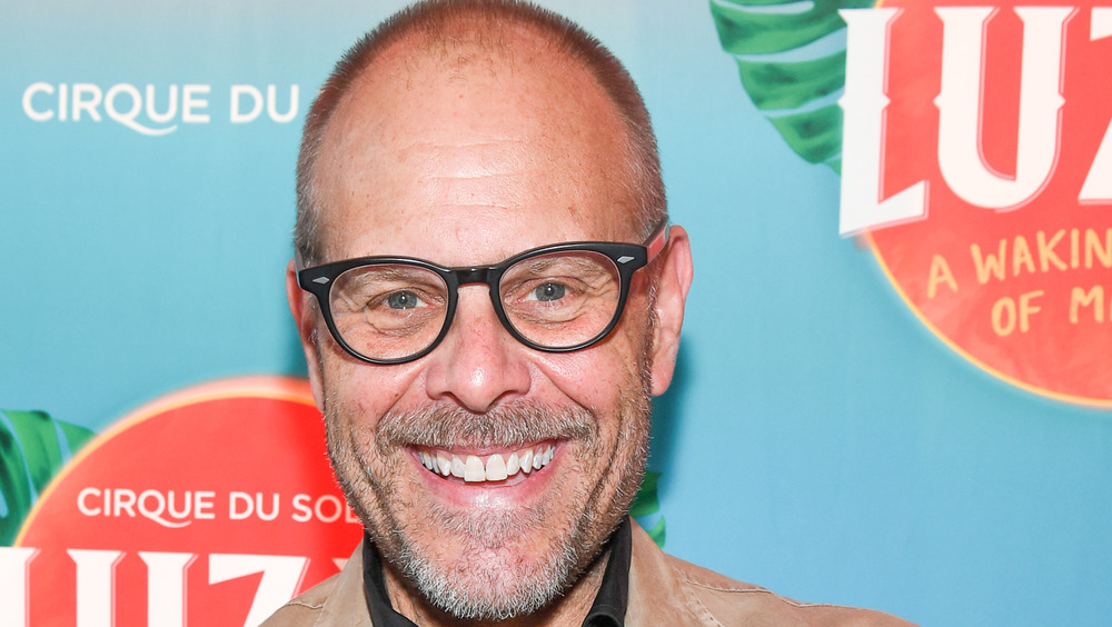 Alton Brown smiling in glasses