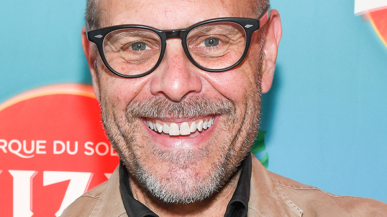 Alton Brown with wide smile and glasses