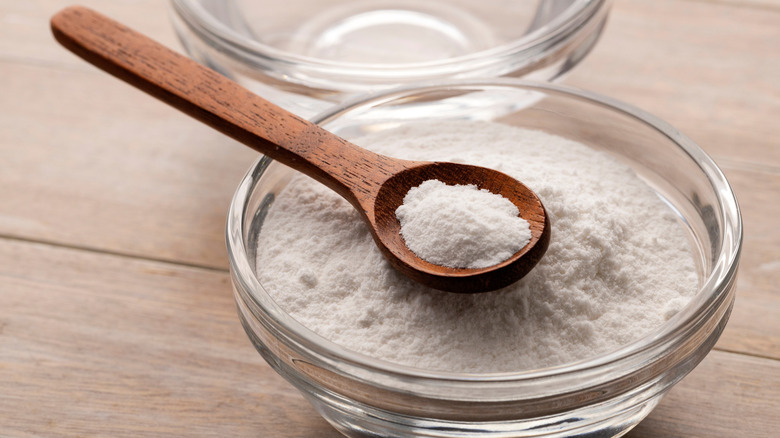 Spoon in bowl of baking soda