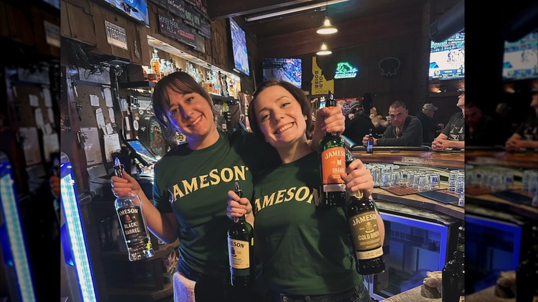 staff holding bottles