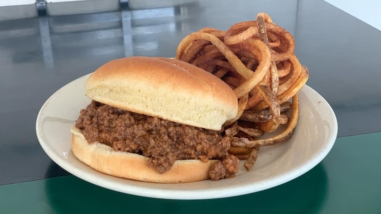 A sloppy Joe with fries on a plate at South Side Soda Shop