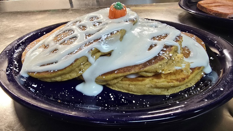 A plate of pancakes covered in icing at Darcy's Cafe