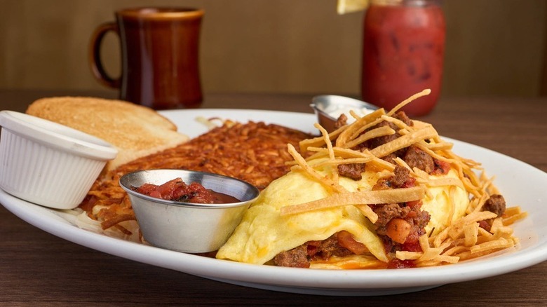 A hearty omelette with crispy toppings and toast at Fuller's Coffee Shop