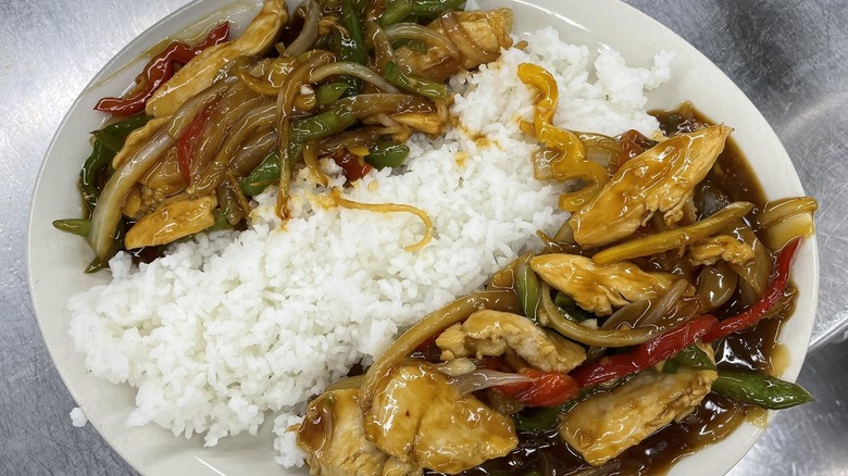 Honey glazed chicken with peppers and onions over rice at Cheyenne Crossing