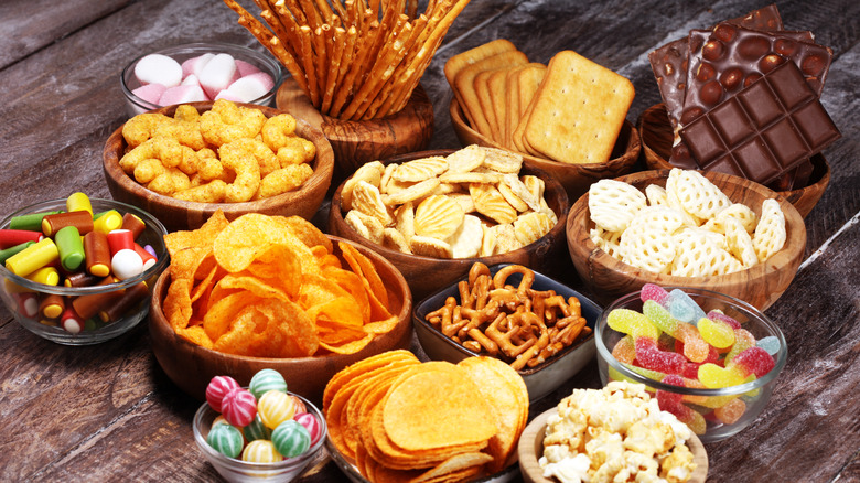 A variety of snack foods in bowls 