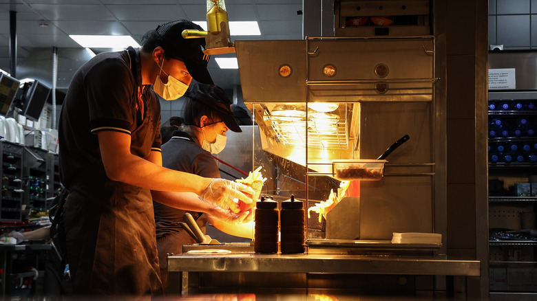 McDonald's worker with French fries