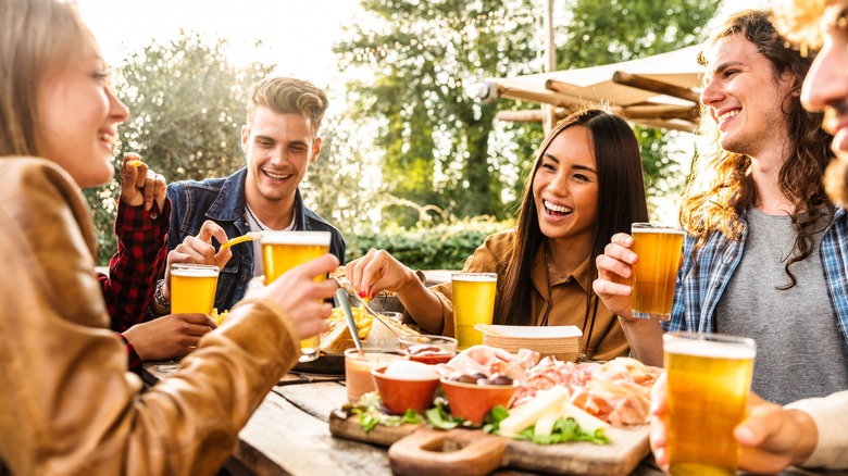 group of friends having dinner and drinks