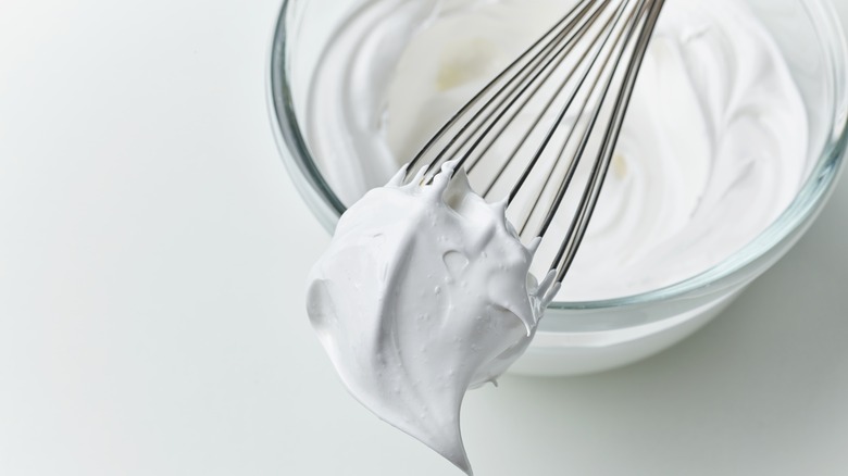 Beaten egg whites on a whisk