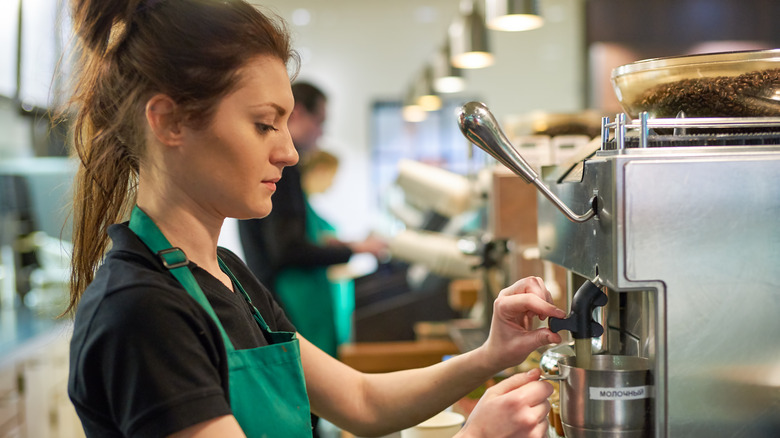 Starbucks employee making a drink