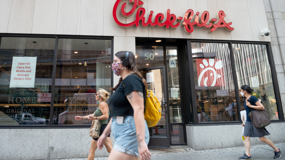 Pedestrians passing Chick-fil-A