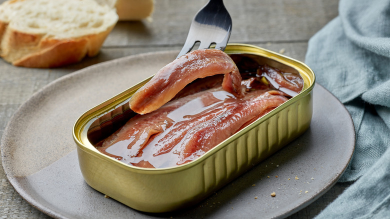 tin of anchovies on plate