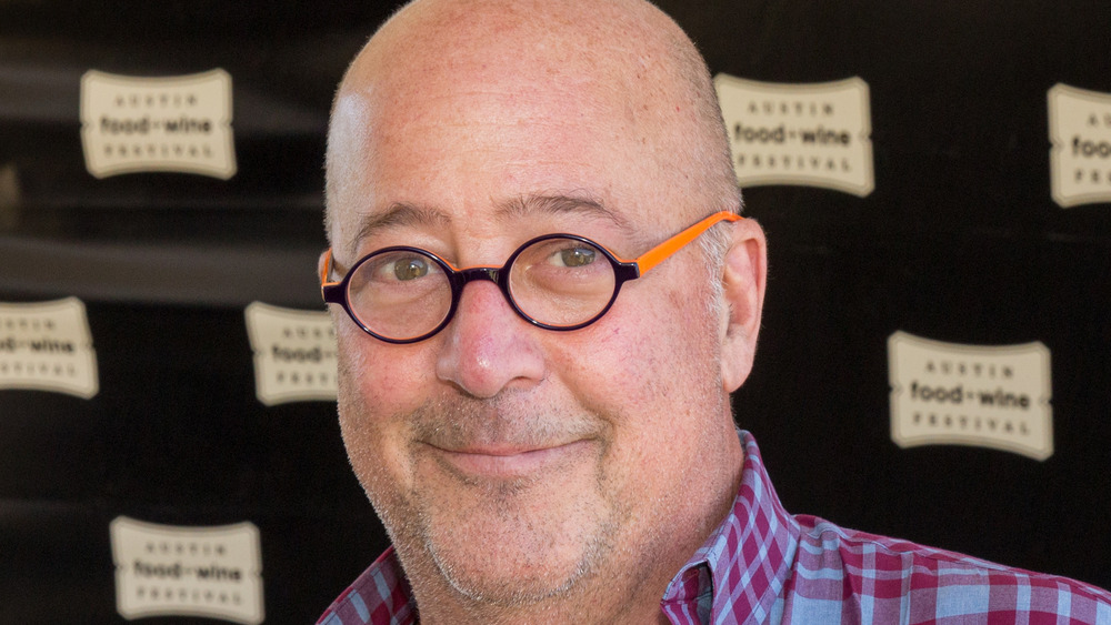 Andrew Zimmern wearing glasses