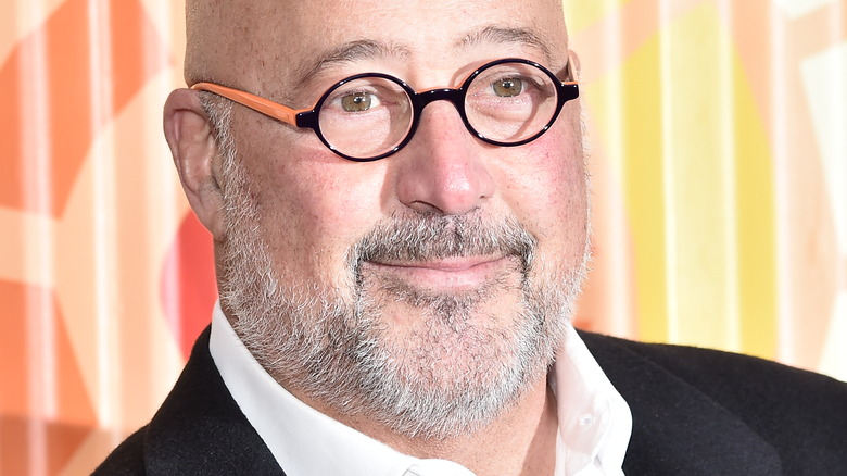 Andrew Zimmern wearing glasses