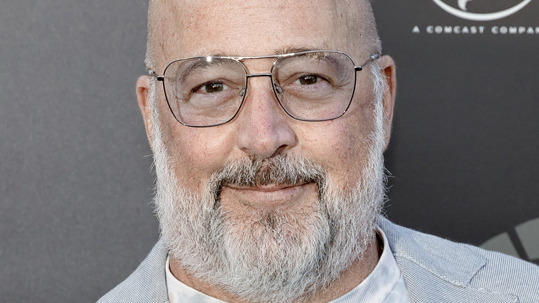 Andrew Zimmern in glasses with gray beard