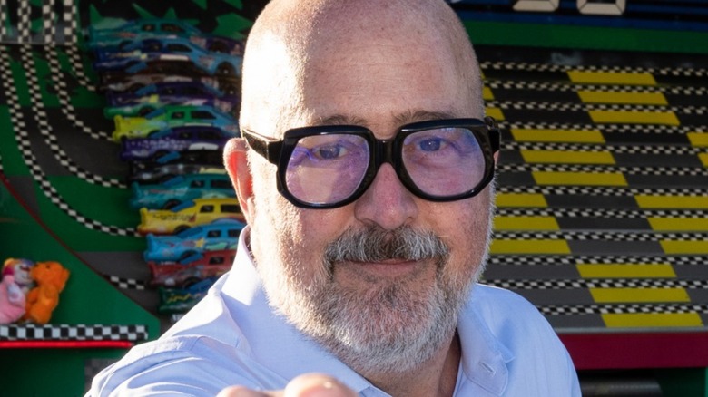 Andrew Zimmern in black glasses