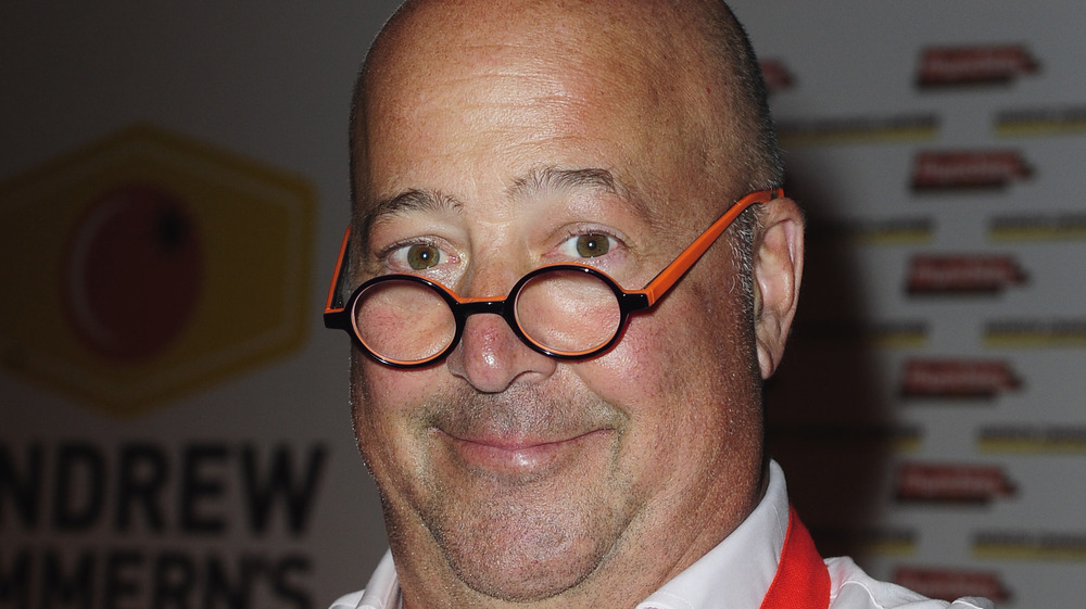 Andrew Zimmern wears signature glasses 