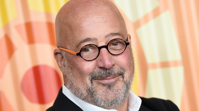 Andrew Zimmern in black and orange glasses