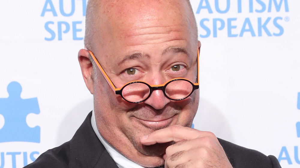 Andrew Zimmern smiling at event 