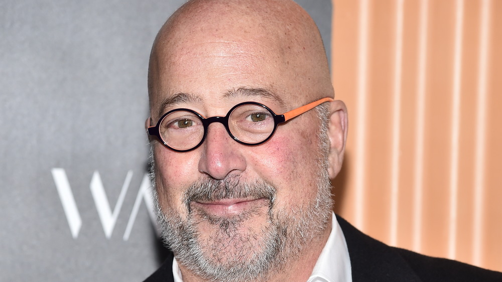 Andrew Zimmern in black and orange glasses