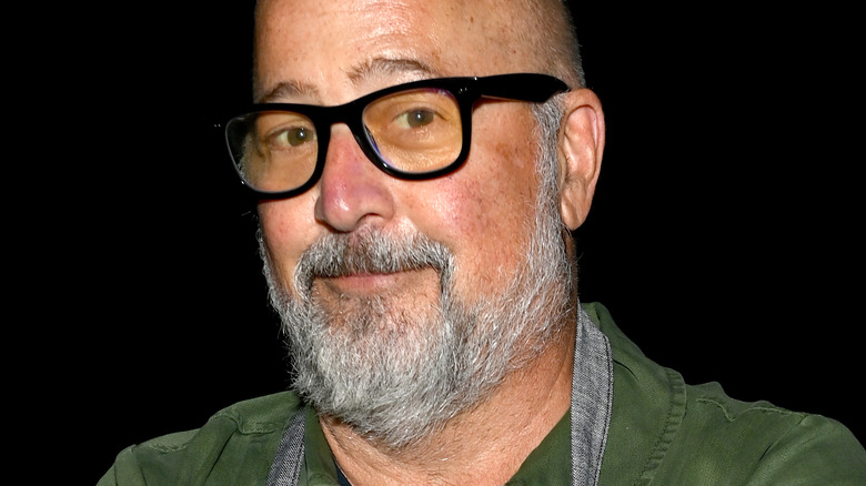 Andrew Zimmern with glasses and slight smile