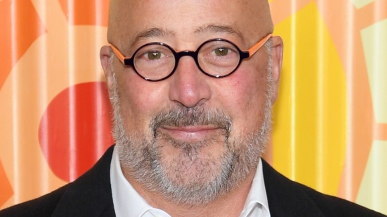 Andrew Zimmern smirking 