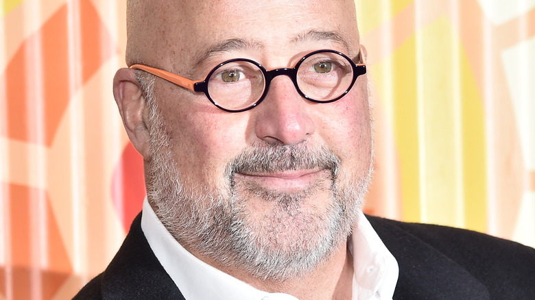 Andrew Zimmern smirking 