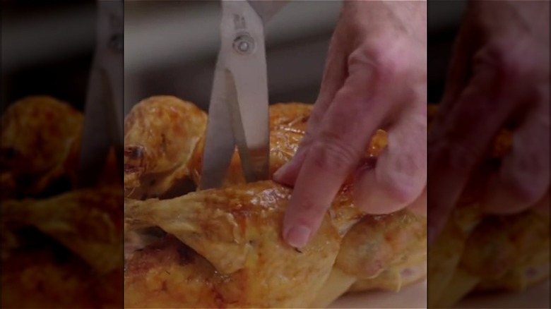 Cutting chicken with shears