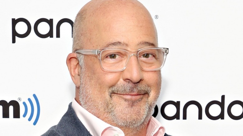 Andrew Zimmern wearing glasses