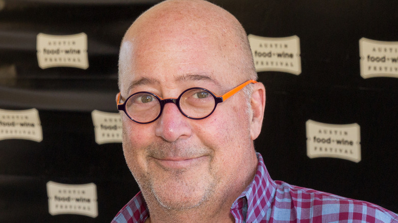 Andrew Zimmern in a plaid shirt