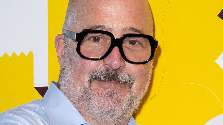 Andrew Zimmern with beard and glasses