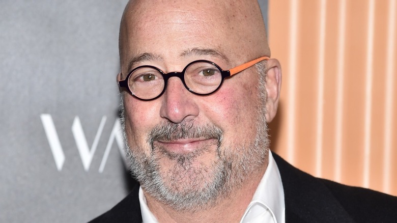 Andrew Zimmern wearing glasses