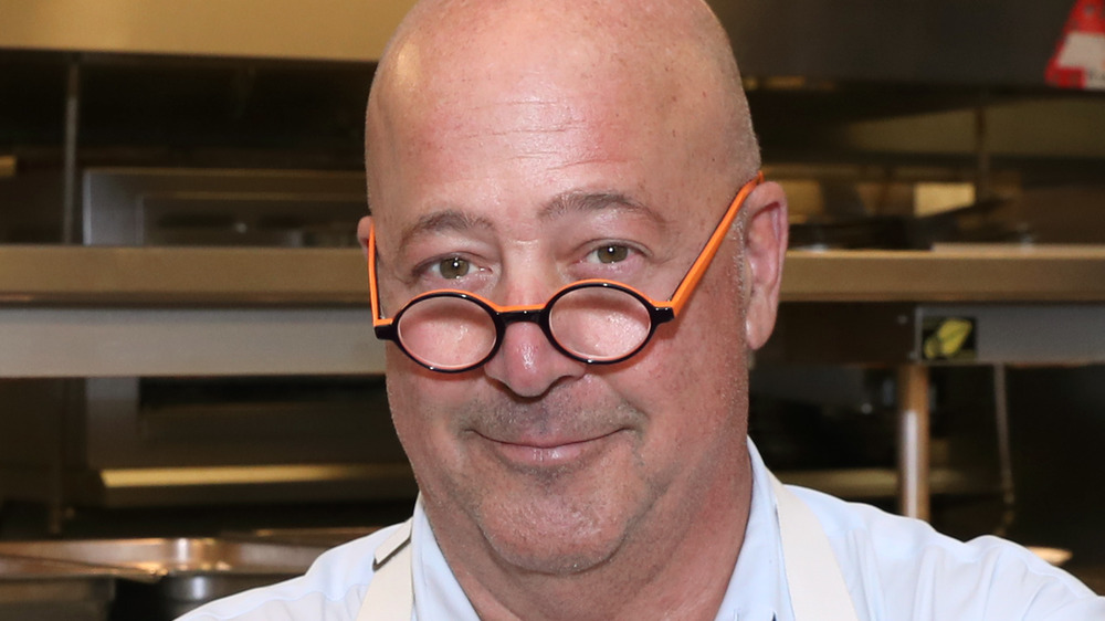 Andrew Zimmern wearing glasses