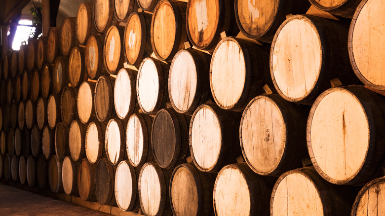 Stacked tequila aging barrels