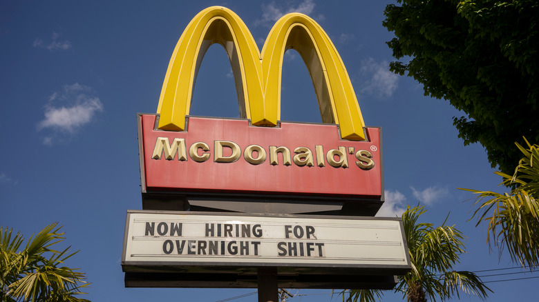 McDonald's sign that reads "Now hiring for overnight shift"