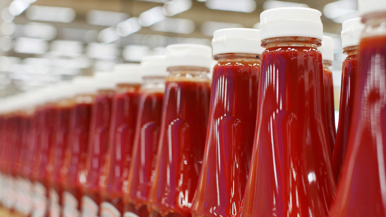 Row of ketchup bottles at a grocery store