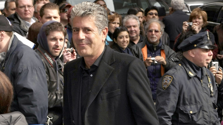 A slightly younger Anthony Bourdain walking outside