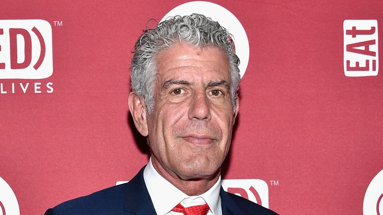 chef Anthony Bourdain posing for picture at public event